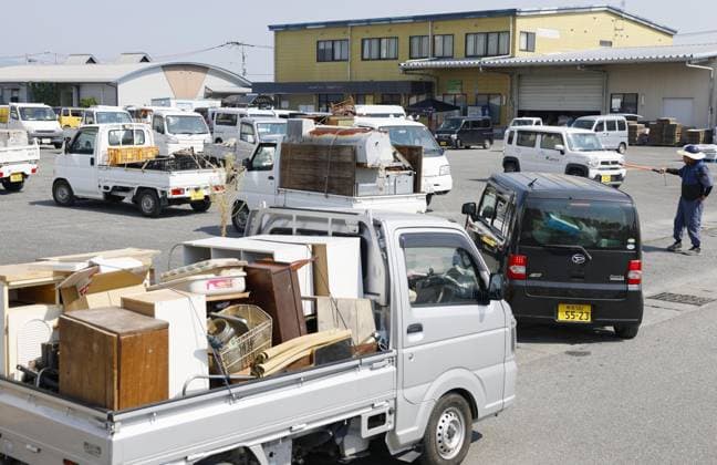 Aftermath of strong earthquake in Kumamoto Vehicles carrying waste and rubble arrive at a garbage-collecting site in Hikawa, Kumamoto Prefecture, southwestern Japan, on Aug. 3, 2026, after a powerful earthquake struck the region on July 28.  A14AA0005624984P