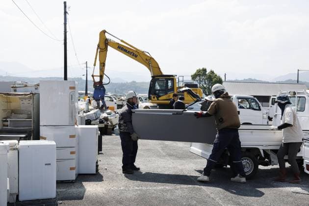Aftermath of strong earthquake in Kumamoto A vehicle unloads waste and rubble onto a garbage-collecting site in Hikawa, Kumamoto Prefecture, southwestern Japan, on Aug. 3, 2026, after a powerful earthquake struck the region on July 28.  A14AA0005624985P