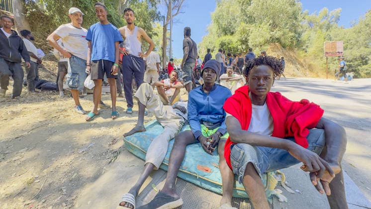 Migrant crisis in Cueta An unprecedented border crisis has hit the Spanish North African enclave of Ceuta, where an estimated 60,000 migrants crossed from Morocco. Pictured. African migrants resting on the street. 02.08.2026  Copyright: xIanxWhittakerx NINTCHDBPICT001099189107