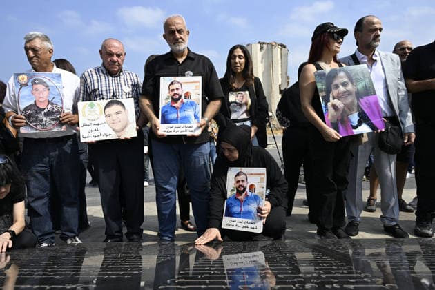 Memorial ceremony held in Lebanon to mark sixth anniversary of Beirut Port explosion BEIRUT, LEBANON - AUGUST 4: People attend a memorial ceremony held in front of the monument bearing the names of those killed in the Aug. 4, 2020 Beirut Port explosion, marking the sixth anniversary of the disaster while holding photos, in Beirut, Lebanon, on August 4, 2026. The ceremony was attended by families of the victims, Lebanese Justice Minister Adel Nassar, Information Minister Paul Markus, Social Affairs Minister Haneen El Sayed, ambassadors of several countries that lost citizens in the explosion, and other members of the diplomatic corps. Houssam Shbaro Anadolu Beirut Lebanon. Editorial use only. Please get in touch for any other usage. Copyright: x2026xAnadoluxHoussamxShbarox