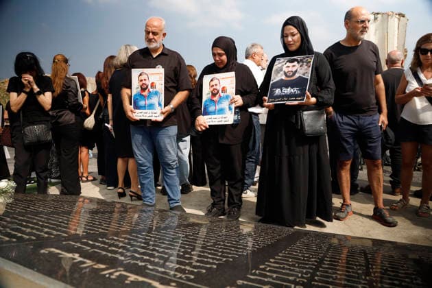 August 4, 2026, Beirut, Beirut, lebanon: Families of victims of the August 4, 2020 Beirut port explosion gather inside the Beirut Port in front of the memorial bearing the names of Lebanese and foreign victims, marking the sixth anniversary of the devastating blast, in Beirut, Lebanon, August 4, 2026. Beirut lebanon - ZUMAb339 20260804_znp_b339_005 Copyright: xAbdulxKaderxAlxBayx