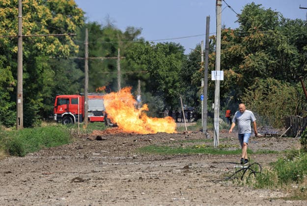 A fire caused by a Russian missile attack burns near railway tracks in Odesa, Ukraine, August 4, 2026. Russian forces carried out a missile strike near a market on the outskirts of the city. Civilian infrastructure was damaged, and at least three people were injured. (Photo by Nina Liashonok Ukrinform) Russia attacks suburbs of Odesa with missiles  Copyright: xNinaxLiashonokx