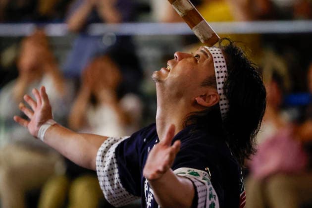 August 5, 2026, Akita, Japan: A participant balances a bamboo pole adorned with paper lanterns (kanto) on his forehead during the Akita Kanto Festival in Akita City. The annual event is one of the Tohoku region s three great festivals, where street performers skillfully balance over 270 towering bamboo poles (with the largest measuring 12 meters and weighing 50 kilograms) adorned with up to 46 candle-lit paper lanterns on their hands, shoulders, and foreheads to the rhythmic chant of dokkoisho. The festival runs from August 3 to 6. Akita Japan - ZUMAm191 20260805_aap_m191_024 Copyright: xRodrigoxReyesxMarinx