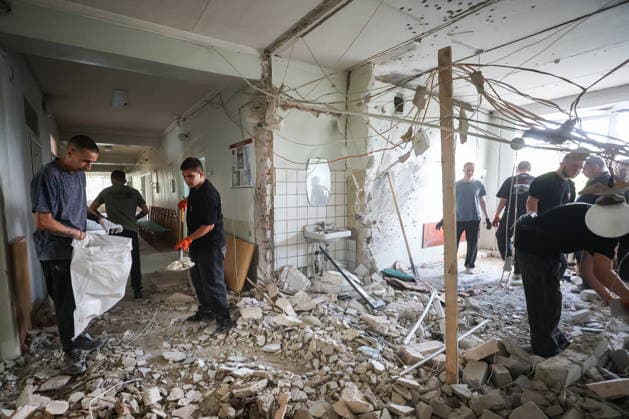 RUSSIA, DONETSK - AUGUST 5, 2026: Local residents clear the debris in a gastroenterology ward of Donetsk City Clinical Hospital No 7 following a Ukrainian drone strike. The attack left one patient dead and two others injured. Dmitry Yagodkin TASS  95820406