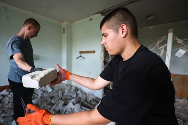 RUSSIA, DONETSK - AUGUST 5, 2026: Local residents clear the debris in a gastroenterology ward of Donetsk City Clinical Hospital No 7 following a Ukrainian drone strike. The attack left one patient dead and two others injured. Dmitry Yagodkin TASS  95820414