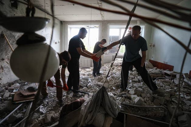 RUSSIA, DONETSK - AUGUST 5, 2026: Local residents clear the debris in a gastroenterology ward of Donetsk City Clinical Hospital No 7 following a Ukrainian drone strike. The attack left one patient dead and two others injured. Dmitry Yagodkin TASS  95820416