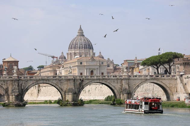 (260805) -- ROME, Aug. 5, 2026 -- A ship is seen on the Tiber River in Rome, Italy, Aug. 5, 2026. Italy is battling its fourth major heatwave of the summer, with temperatures climbing above 40 degrees Celsius in parts of the country, and a record number of cities placed under the highest heat alert. Authorities are stepping up emergency measures amid mounting health, wildfire and agricultural concerns. The latest heatwave reached its peak on Monday, when the Health Ministry placed 25 of the country s 27 monitored cities under red alert, the highest warning level possible issued for extreme heat. ) ITALY-ROME-TIBER RIVER-HEAT WAVE WangxKaiyan