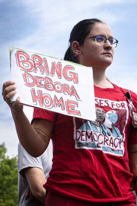 August 5, 2026, Portland, Maine, USA: Members of the Maine State Nurses Association union protest federal Immigration and Customs Enforcement (ICE) on the lawn outside Maine Medical Center, the stateâ€⠢s largest hospital, on Wednesday morning, August 5, 2026. Nurses demanded the release of colleague and medical-surgical nurse, DEBORA KAPISHA, who was detained by federal officials at Logan Airport in Boston on July 30, 2026. Union members said KAPISHA, originally from Zambia, has federal authorization to work in Maine while awaiting the outcome of her asylum case. In addition to KAPISHAâ€⠢S release, union members demanded their employer, Maine Medical Center, take immediate steps to formally sponsor KAPISHA for permanent residency. - ZUMAb349 20260805_znp_b349_003 Copyright: xTroyxR.xBennettx