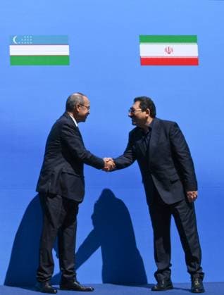 Kyrgyzstan Eurasian Intergovernmental Council 9218445 07.08.2026 Uzbek Prime Minister Abdulla Aripov and Iranian Minister of Industry, Mine and Trade Mohammad Atabak shake hands during a family photo opportunity before an expanded format meeting of the Eurasian Intergovernmental Council in Cholpon-Ata, Kyrgyzstan. Kirill Zykov Sputnik Cholpon-Ata Kyrgyzstan  Copyright: xKirillxZykovx