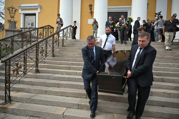 Men carry the coffin of Polish volunteer Marek Rusek-Wolski, who was killed near Kharkiv by a Russian drone attack, from the Cathedral of St Alexander after the farewell ceremony in Kyiv, Ukraine, August 7, 2026. The tragedy occurred at the end of July (approximately 27 July) near Kharkiv, when the volunteer came under a targeted Russian drone strike while on a humanitarian mission. Marek Rusek-Wolski was an administrator of the Polish volunteer community Razem dla Ukrainy. Since early 2023, he had been regularly travelling to Ukraine. He used to organise fundraisers, purchase and deliver food, medicines, hygiene products and animal feed to the most dangerous front-line settlements in the Kharkiv region. (Photo by Yevhen Kotenko Ukrinform) Copyright: xYevhenxKotenkox