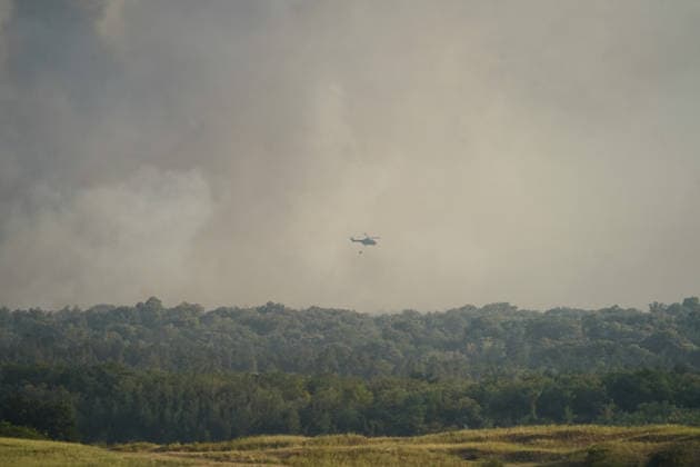 August 7, 2026, Sumarak, Vojvodina, Serbia: 202687, Sumarak, Serbia - Thick smoke rises above the landscape as a massive wildfire burns through the Deliblato Sands (Deliblatska Pescara) Special Nature Reserve. Helicopters of the Serbian Armed Forces are deployed to combat the blaze, using Bambi buckets to fetch water and extinguish the fire from the air. Deliblato Sands, often referred to as the European Sahara, is a strictly protected natural area. Sumarak Serbia  - ZUMAd223 20260807_zip_d223_010 Copyright: xMarkoxDimicx