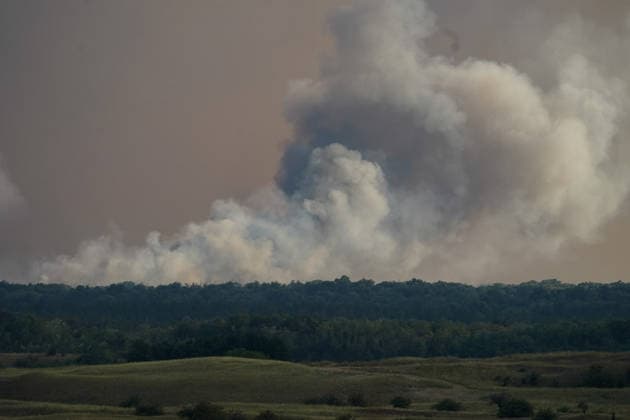 August 7, 2026, Sumarak, Vojvodina, Serbia: 202687, Sumarak, Serbia - Thick smoke rises above the landscape as a massive wildfire burns through the Deliblato Sands (Deliblatska Pescara) Special Nature Reserve. Helicopters of the Serbian Armed Forces are deployed to combat the blaze, using Bambi buckets to fetch water and extinguish the fire from the air. Deliblato Sands, often referred to as the European Sahara, is a strictly protected natural area. Sumarak Serbia  - ZUMAd223 20260807_zip_d223_012 Copyright: xMarkoxDimicx
