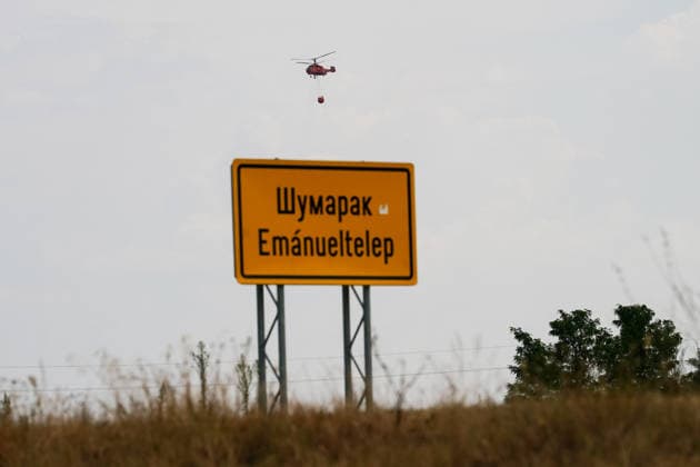August 7, 2026, Sumarak, Vojvodina, Serbia: 202687, Sumarak, Serbia - Thick smoke rises above the landscape as a massive wildfire burns through the Deliblato Sands (Deliblatska Pescara) Special Nature Reserve. Helicopters of the Serbian Armed Forces are deployed to combat the blaze, using Bambi buckets to fetch water and extinguish the fire from the air. Deliblato Sands, often referred to as the European Sahara, is a strictly protected natural area. Sumarak Serbia - ZUMAd223 20260807_zip_d223_001 Copyright: xMarkoxDimicx