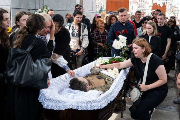 Hundreds attend the funeral of search and rescue volunteer Oleksii Yukov in Kyiv KYIV, UKRAINE - AUGUST 08: (EDITOR S NOTE: Image depicts death) Hundreds attend the funeral of search and rescue volunteer Oleksii Yukov in Kyiv, Ukraine, on August 08, 2026. Yukov was killed during a mission to retrieve the bodies of fallen Ukrainian soldiers in Donetsk region of Ukraine. Yukov had been conducting search and rescue missions to retrieve bodies of fallen Ukrainian soldiers sjnce 2014. Danylo Antoniuk Anadolu Kyiv Ukraine. Editorial use only. Please get in touch for any other usage.  Copyright: x2026xAnadoluxDanyloxAntoniukx