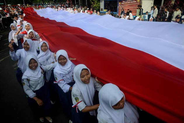 August 9, 2026, Bogor, West Java, Indonesia: Students take part in carrying a 500-metre-long national flag as they marched through the streets of Bogor, West Java, during the ˜Merah Putih™ Festival parade ahead of Indonesia™s 81st Independence Day celebrations. Bogor Indonesia  - ZUMAa216 20260809_zip_a216_001 Copyright: xAdrianaxAdiex