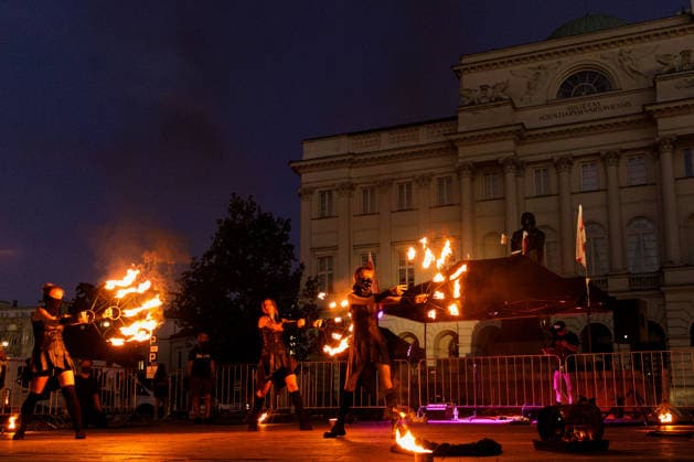 August 9, 2026, Warsaw, Poland: A flare burns near the Nicolaus Copernicus Monument during an evening rally marking the sixth anniversary of the August 2020 presidential election in Belarus. An evening gathering marking the sixth anniversary of the August 2020 presidential election in Belarus was held near the Nicolaus Copernicus Monument in central Warsaw, bringing together leaders of Belarusian democratic forces, public figures and activists, as well as several hundred participants. Warsaw Poland  - ZUMAs197 20260809_aaa_s197_105 Copyright: xVolhaxShukailax
