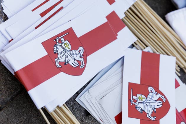 August 9, 2026, Warsaw, Poland: Belarusian national white-red-white flags and Pahonia emblems are sold during an evening rally marking the sixth anniversary of the August 2020 presidential election in Belarus in central Warsaw. An evening gathering marking the sixth anniversary of the August 2020 presidential election in Belarus was held near the Nicolaus Copernicus Monument in central Warsaw, bringing together leaders of Belarusian democratic forces, public figures and activists, as well as several hundred participants. Warsaw Poland - ZUMAs197 20260809_aaa_s197_104 Copyright: xVolhaxShukailax