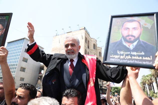 Death sentences for Bashar al-Assad and senior figures in Syria welcomed with celebrations DAMASCUS, SYRIA - AUGUST 11: Syrians gather around the Palace of Justice to celebrate a court s death sentences against ousted leader Bashar al-Assad, his brother Maher al-Assad and his cousin Atef Najib, carrying photographs of people killed by the Assad regime, in the capital Damascus, Syria, on August 11, 2026. Izz Aldien Alqasem Anadolu Damascus Syria. Editorial use only. Please get in touch for any other usage.  Copyright: x2026xAnadoluxIzzxAldienxAlqasemx