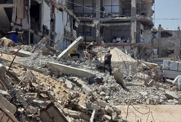 Palestinians Clear Rubble to Return to Destroyed Homes in Khan Younis Palestinians clear rubble from their destroyed homes in Khan Younis refugee camp in the southern Gaza Strip, on August 11, 2026, as they prepare to move their tents to the area amid continued rubble accumulation and delays in debris removal and reconstruction. Families say overcrowding and the spread of insects and rodents in displacement areas have prompted them to try to return to the sites of their destroyed homes. Photo by Tariq Mohammad APA Images Khan Yunis Gaza Strip Palestinian Territory 110826_Khan_Yunis_TM_01(23) Copyright: xapaimagesxTariqxMohammad xapaimagesx