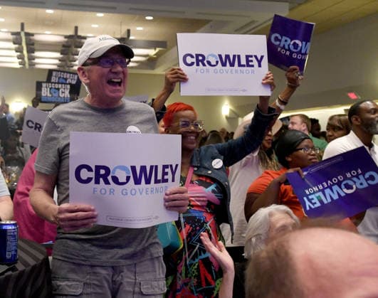 August 11, 2026, Milwaukee, Wisconsin, USA: Supporters of Democratic gubernatorial candidate David Crowley react to television news reports during a watch party Tuesday night August 11, 2026 at the Hyatt Regency hotel in downtown Milwaukee. Crowley had not appeared by Midnight. The race against Francesca Hong was still very close when it was announced that human error caused a delay in counting absentee ballots from Milwaukee. Milwaukee USA - ZUMAh154 20260811_znp_h154_039 Copyright: xMarkxHertzbergx