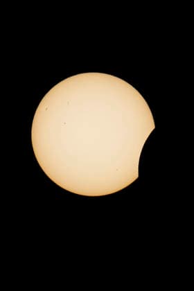 This image shows a partial solar eclipse captured in Hemiksem on %datetext. The moon will cover about 90% of the sun during this solar eclipse. %PHOTOGRAPHER  TomxGoyvaerts 183228936