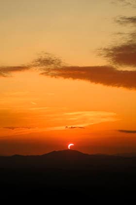 Solar Eclipse over Mount Nerone A solar eclipse photographed from Top of Mount Nerone, at 1,550 metres above sea level in the Tusco-Romagnolo Apennines, Italy. From this latitude, the eclipse was visible only as a partial eclipse. Italy Copyright: xAndreaxCalandrax