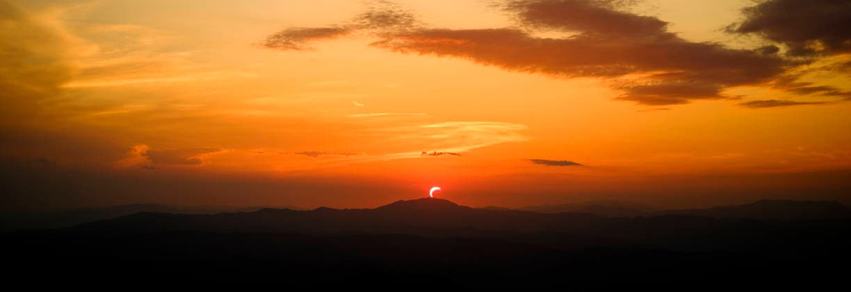Solar Eclipse over Mount Nerone A solar eclipse photographed from Top of Mount Nerone, at 1,550 metres above sea level in the Tusco-Romagnolo Apennines, Italy. From this latitude, the eclipse was visible only as a partial eclipse. Italy Copyright: xAndreaxCalandrax