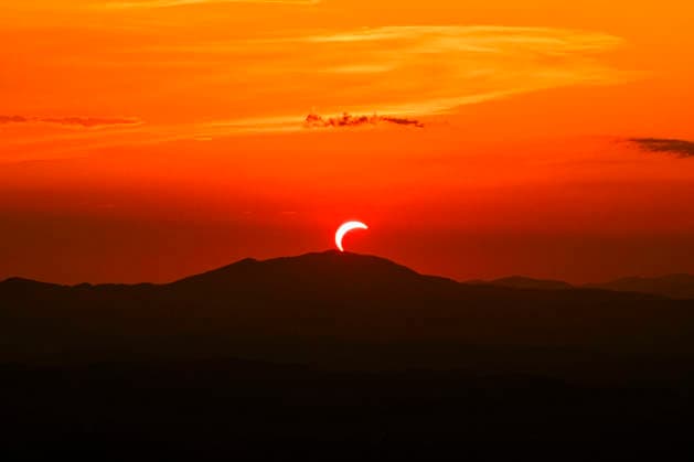 Solar Eclipse over Mount Nerone A solar eclipse photographed from Top of Mount Nerone, at 1,550 metres above sea level in the Tusco-Romagnolo Apennines, Italy. From this latitude, the eclipse was visible only as a partial eclipse. Italy Copyright: xAndreaxCalandrax