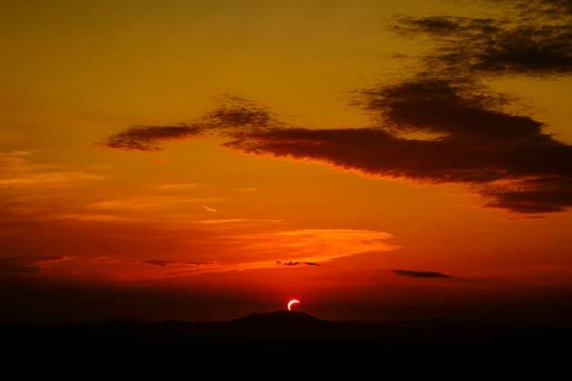 Solar Eclipse over Mount Nerone A solar eclipse photographed from Top of Mount Nerone, at 1,550 metres above sea level in the Tusco-Romagnolo Apennines, Italy. From this latitude, the eclipse was visible only as a partial eclipse. Italy Copyright: xAndreaxCalandrax