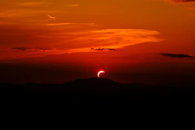 Solar Eclipse over Mount Nerone A solar eclipse photographed from Top of Mount Nerone, at 1,550 metres above sea level in the Tusco-Romagnolo Apennines, Italy. From this latitude, the eclipse was visible only as a partial eclipse. Italy Copyright: xAndreaxCalandrax