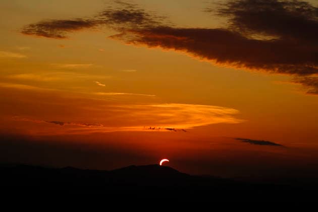 Solar Eclipse over Mount Nerone A solar eclipse photographed from Top of Mount Nerone, at 1,550 metres above sea level in the Tusco-Romagnolo Apennines, Italy. From this latitude, the eclipse was visible only as a partial eclipse. Italy Copyright: xAndreaxCalandrax