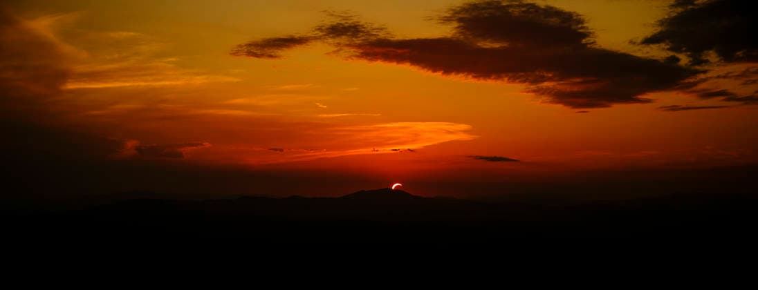 Solar Eclipse over Mount Nerone A solar eclipse photographed from Top of Mount Nerone, at 1,550 metres above sea level in the Tusco-Romagnolo Apennines, Italy. From this latitude, the eclipse was visible only as a partial eclipse. Italy Copyright: xAndreaxCalandrax