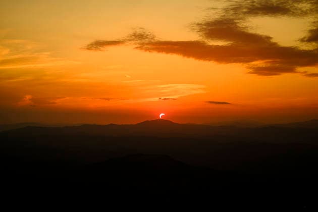 Solar Eclipse over Mount Nerone A solar eclipse photographed from Top of Mount Nerone, at 1,550 metres above sea level in the Tusco-Romagnolo Apennines, Italy. From this latitude, the eclipse was visible only as a partial eclipse. Italy Copyright: xAndreaxCalandrax