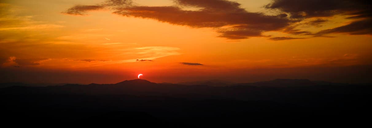 Solar Eclipse over Mount Nerone A solar eclipse photographed from Top of Mount Nerone, at 1,550 metres above sea level in the Tusco-Romagnolo Apennines, Italy. From this latitude, the eclipse was visible only as a partial eclipse. Italy Copyright: xAndreaxCalandrax