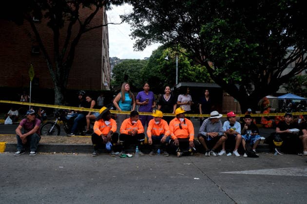 August 12, 2026, Cali, Valle Del Cauca, Colombia: People gather outside collapsed buildings in Cali, Colombia on August 12, 2026 to aid in several rescue labors after a 7,4 magnitude earthquake that struck the cities of Quibdo, Cali, Pereira and Manizales leaving more than 200 casualties past august 10. Cali Colombia - ZUMAvp1_ 20260812_zia_vp1_007 Copyright: xMartinxStevenxAngelx