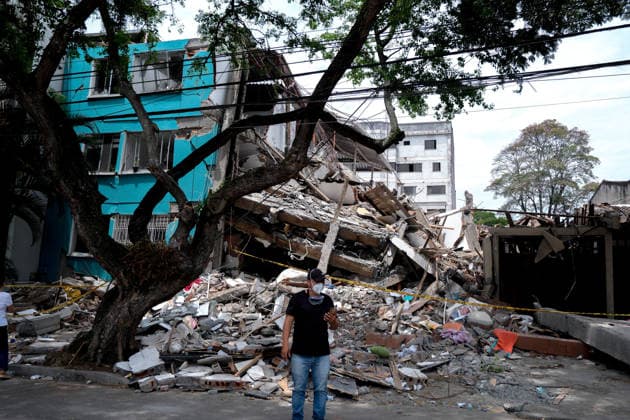 August 12, 2026, Cali, Valle Del Cauca, Colombia: People gather outside collapsed buildings in Cali, Colombia on August 12, 2026 to aid in several rescue labors after a 7,4 magnitude earthquake that struck the cities of Quibdo, Cali, Pereira and Manizales leaving more than 200 casualties past august 10. Cali Colombia - ZUMAvp1_ 20260812_zia_vp1_030 Copyright: xMartinxStevenxAngelx