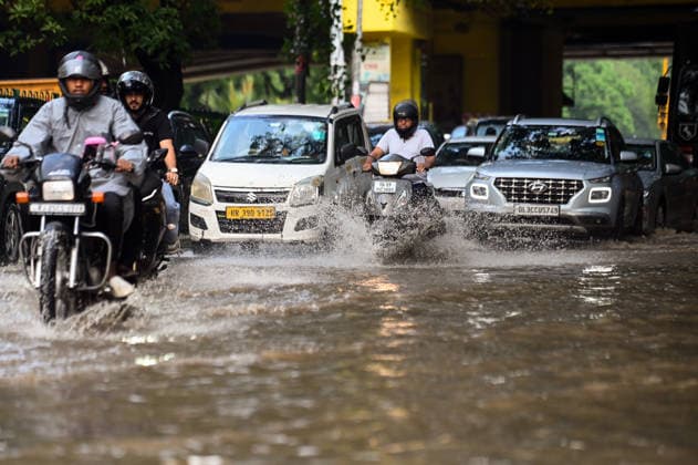 Heavy rain lashes parts of the National Capital New Delhi, Aug 13 (ANI): Commuters wade through a waterlogged road near SIR M. Vishweshwariah Moti Bagh metro station following heavy rainfall, in New Delhi on Thursday. New Delhi Delhi India Copyright: xANIx ANI_20260813273