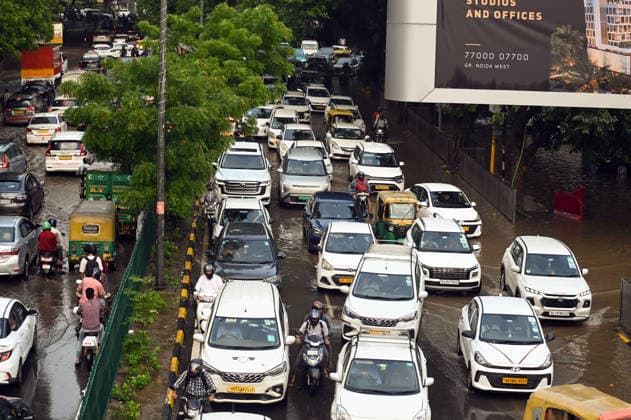 Heavy rain lashes parts of the National Capital New Delhi, Aug 13 (ANI): Commuters wade through a waterlogged road near SIR M. Vishweshwariah Moti Bagh metro station following heavy rainfall, in New Delhi on Thursday. New Delhi Delhi India Copyright: xANIx ANI_20260813277