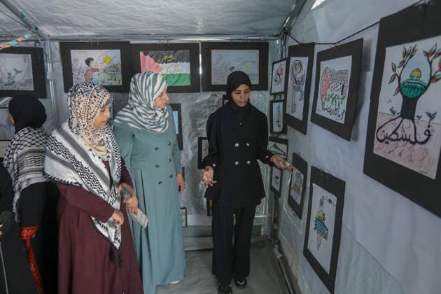 Palestinian children reflect war, displacement and hope through Art in Khan Yunis KHAN YUNIS, GAZA , PALESTINE - AUGUST 13: Works by Palestinian children are brought together in the exhibition held inside a tent at a refugee camp in the Al-Mawasi area of Khan Yunis, Gaza, Palestine on August 13, 2026. Created amid the severe humanitarian conditions resulting from the attacks that have continued since Oct. 2023, the artworks depict the children s experiences of displacement, destruction, hunger, water shortages and the loss of loved ones. Abed Rahim Khatib Anadolu Han Yunus Palestinian Territory, Occupied. Editorial use only. Please get in touch for any other usage. Copyright: x2026xAnadoluxAbedxRahimxKhatibx
