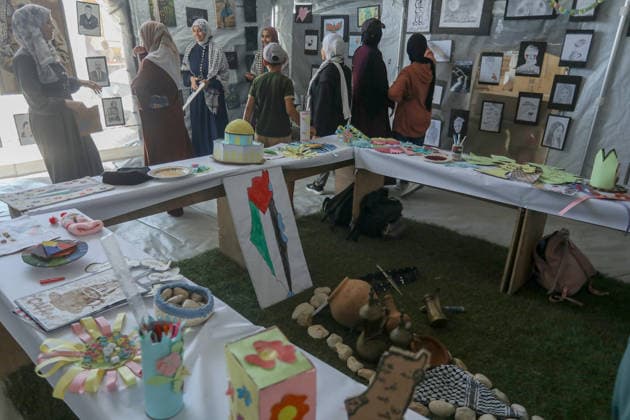 Palestinian children reflect war, displacement and hope through Art in Khan Yunis KHAN YUNIS, GAZA , PALESTINE - AUGUST 13: Works by Palestinian children are brought together in the exhibition held inside a tent at a refugee camp in the Al-Mawasi area of Khan Yunis, Gaza, Palestine on August 13, 2026. Created amid the severe humanitarian conditions resulting from the attacks that have continued since Oct. 2023, the artworks depict the children s experiences of displacement, destruction, hunger, water shortages and the loss of loved ones. Abed Rahim Khatib Anadolu Han Yunus Palestinian Territory, Occupied. Editorial use only. Please get in touch for any other usage.  Copyright: x2026xAnadoluxAbedxRahimxKhatibx