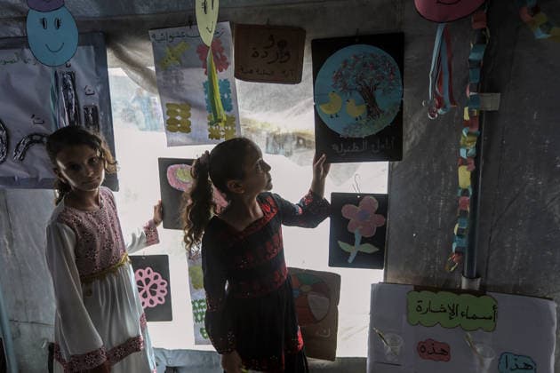 Palestinian children reflect war, displacement and hope through Art in Khan Yunis KHAN YUNIS, GAZA , PALESTINE - AUGUST 13: Works by Palestinian children are brought together in the exhibition held inside a tent at a refugee camp in the Al-Mawasi area of Khan Yunis, Gaza, Palestine on August 13, 2026. Created amid the severe humanitarian conditions resulting from the attacks that have continued since Oct. 2023, the artworks depict the children s experiences of displacement, destruction, hunger, water shortages and the loss of loved ones. Abed Rahim Khatib Anadolu Han Yunus Palestinian Territory, Occupied. Editorial use only. Please get in touch for any other usage.  Copyright: x2026xAnadoluxAbedxRahimxKhatibx
