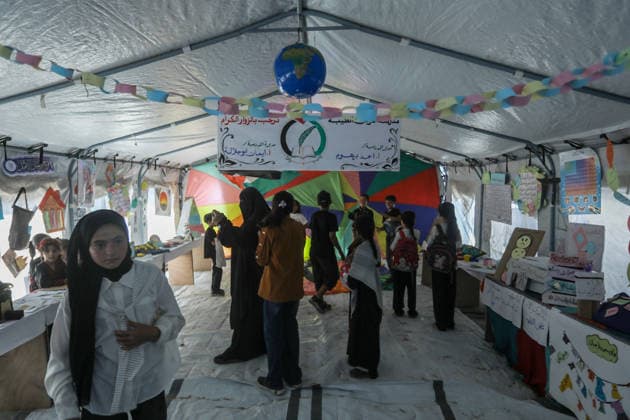 Palestinian children reflect war, displacement and hope through Art in Khan Yunis KHAN YUNIS, GAZA , PALESTINE - AUGUST 13: Works by Palestinian children are brought together in the exhibition held inside a tent at a refugee camp in the Al-Mawasi area of Khan Yunis, Gaza, Palestine on August 13, 2026. Created amid the severe humanitarian conditions resulting from the attacks that have continued since Oct. 2023, the artworks depict the children s experiences of displacement, destruction, hunger, water shortages and the loss of loved ones. Abed Rahim Khatib Anadolu Han Yunus Palestinian Territory, Occupied. Editorial use only. Please get in touch for any other usage.  Copyright: x2026xAnadoluxAbedxRahimxKhatibx
