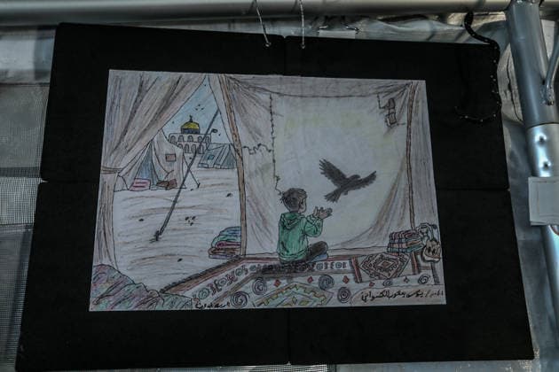 Palestinian children reflect war, displacement and hope through Art in Khan Yunis KHAN YUNIS, GAZA , PALESTINE - AUGUST 13: Works by Palestinian children are brought together in the exhibition held inside a tent at a refugee camp in the Al-Mawasi area of Khan Yunis, Gaza, Palestine on August 13, 2026. Created amid the severe humanitarian conditions resulting from the attacks that have continued since Oct. 2023, the artworks depict the children s experiences of displacement, destruction, hunger, water shortages and the loss of loved ones. Abed Rahim Khatib Anadolu Han Yunus Palestinian Territory, Occupied. Editorial use only. Please get in touch for any other usage.  Copyright: x2026xAnadoluxAbedxRahimxKhatibx