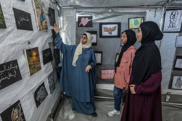 Palestinian children reflect war, displacement and hope through Art in Khan Yunis KHAN YUNIS, GAZA , PALESTINE - AUGUST 13: Works by Palestinian children are brought together in the exhibition held inside a tent at a refugee camp in the Al-Mawasi area of Khan Yunis, Gaza, Palestine on August 13, 2026. Created amid the severe humanitarian conditions resulting from the attacks that have continued since Oct. 2023, the artworks depict the children s experiences of displacement, destruction, hunger, water shortages and the loss of loved ones. Abed Rahim Khatib Anadolu Han Yunus Palestinian Territory, Occupied. Editorial use only. Please get in touch for any other usage.  Copyright: x2026xAnadoluxAbedxRahimxKhatibx