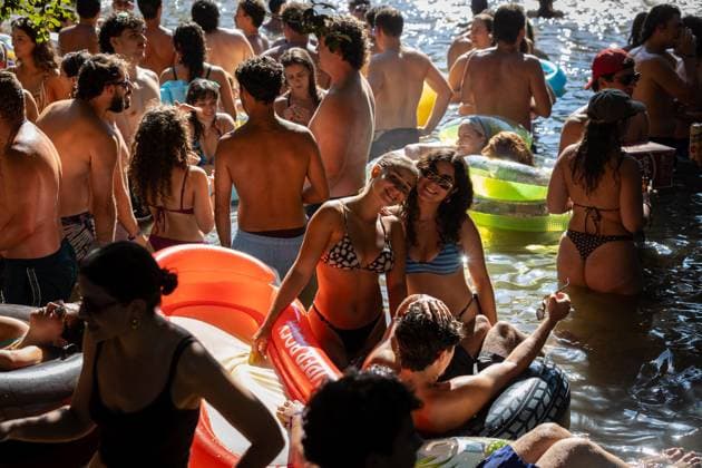 August 13, 2026, Paredes De Coura, Braga, Portugal: Festivalgoers gather into the water at the river Coura known locally as Couraiso during the daytime at Vodafone Paredes de Coura. Paredes De Coura Portugal - ZUMAs197 20260813_aab_s197_015 Copyright: xDiogoxBaptistax