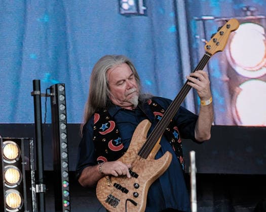 August 13, 2026, Williamscot, Oxfordshire, United Kingdom: Guitarist and jazz bass guitarist, Fred Thelonious Baker of English progressive rock band Soft Machine performs live on stage at Fairport Convention s Cropredy festival. The jazz-rock band was formed during 1966 in Canterbury, Kent. The current line-up consists of guitarist John Etheridge, multi-instrumentalist Theo Travis, bassist Fred Thelonious Baker and drummer Asaf Sirk. Williamscot United Kingdom - ZUMAs197 20260813_aaa_s197_272 Copyright: xDawnxFletcher-Parkx