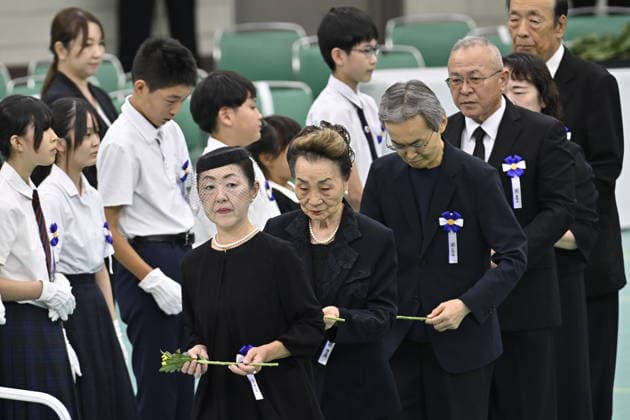 Japan commemorates war dead on 81st anniversary of end of World War II TOKYO, JAPAN - AUGUST 15 : Participants walk in line to offer flowers during the National Memorial Service for the War Dead at the Nippon Budokan in Tokyo, Japan, August 15, 2026. David Mareuil Anadolu Tokyo Japan. Editorial use only. Please get in touch for any other usage.  Copyright: x2026xAnadoluxDavidxMareuilx
