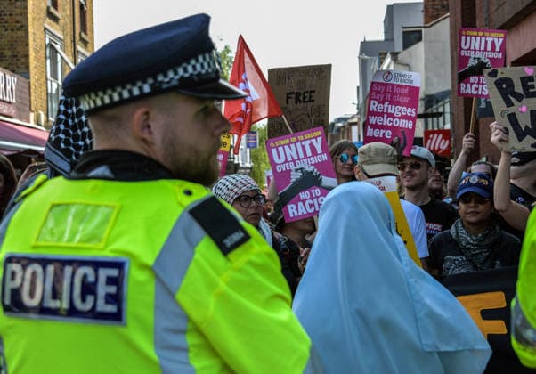 Anti-immigration demonstrators and Stand Up to Racism counter-protesters rally in Maidstone MAIDSTONE, UNITED KINGDOM - AUGUST 15: Activists from Stand Up to Racism assemble outside County Hall in Maidstone, Kent, United Kingdom, on August 15, 2026, to counter-protest against the far-right Kent Nationalist Movement as they gathered before marching through the town center. While the far-right group voiced opposition to government border policies, asylum seeker housing programs, and mass migration, Stand Up to Racism demonstrators chanted slogans and displayed placards to denounce far-right activity and express solidarity with refugees, with police officers maintaining a presence to keep the opposing groups separated. Stuart Brock Anadolu M Copyright: x2026xAnadoluxStuartxBrockx