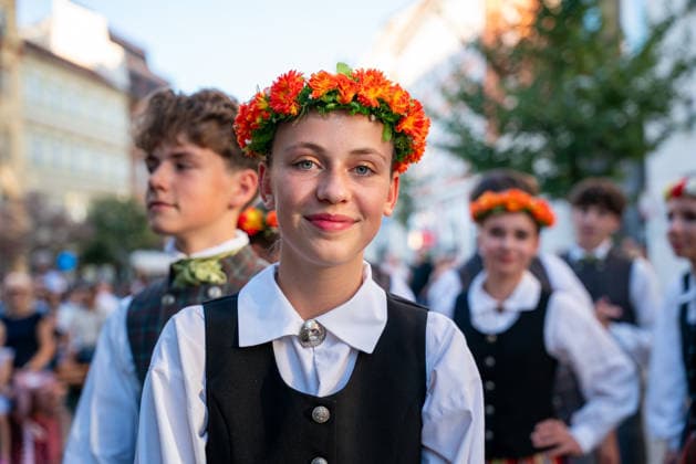 (260815) -- PRAGUE, Aug. 15, 2026 -- People take part in a parade during the Summer Folklore Festival in Prague, the Czech Republic, Aug. 15, 2026. The Summer Folklore Festival was held in Prague on Saturday, bringing together international folklore ensembles presenting their traditional dances, music and costumes. (Photo by Xinhua) CZECH REPUBLIC-PRAGUE-FOLKLORE FESTIVAL DanaxKesnerova 