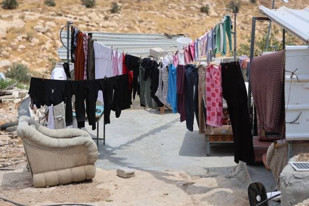August 16, 2026, Masafer Yatta, Palestine, State of: MASAFER YATTA, WEST BANK, PALESTINE, AUGUST 16, 2026: Palestinian Abdullah Dababseh holds his phone displaying a demolition order issued by the Israeli army for the cave where he lives in Khirbet Khallet Al-Dabaa, south of Hebron. According to local residents, demolition orders were issued for three homes, three caves, a school, trees and crops in the area. Residents said the village was demolished in May 2025, forcing some Palestinians to live in caves. Masafer Yatta Palestine, State of - ZUMAq101 20260816_zna_q101_091 Copyright: xMosabxShawerx